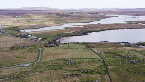 Advancing-aerial-shot-of-the-ancient-Callanish-Standing-Stones-on-the-Isle-of-Lewis,-part-of-the-Outer-Hebrides-of-Scotland