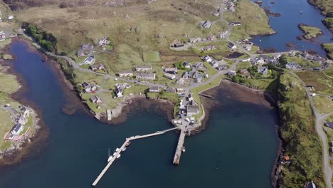 Aerial-drone-shot-of-the-Isle-of-Scalpay,-an-island-near-the-Isles-of-Harris-and-Lewis-on-the-Outer-Hebrides-of-Scotland