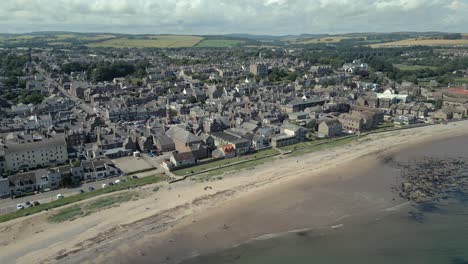 An-aerial-view-of-Stonehaven-beach-front-on-a-sunny-summer-afternoon,-Aberdeenshire,-Scotland,-UK
