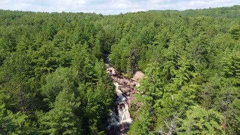 Flying-Through-Duchesnay-Falls-And-Forest-Trails-Near-North-Bay-In-Ontario,-Canada