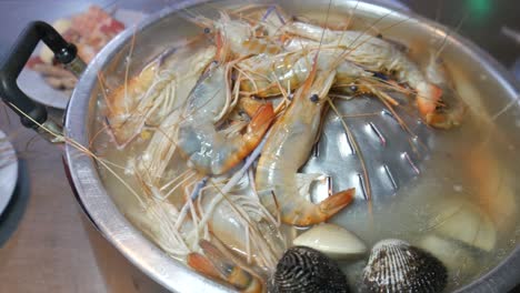 thai-style-seafood-hotpot-cooking-river-prawn-and-clam