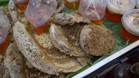 raw-honey-nest-on-counter-for-sale-at-Thailand-street-food-market