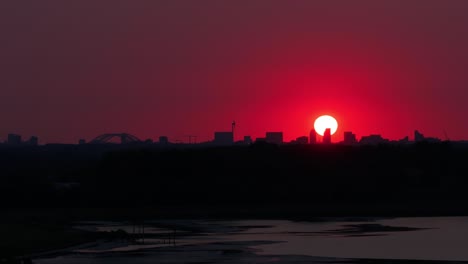 Sun-falls-into-the-red-skyline-above-Rotterdam-city