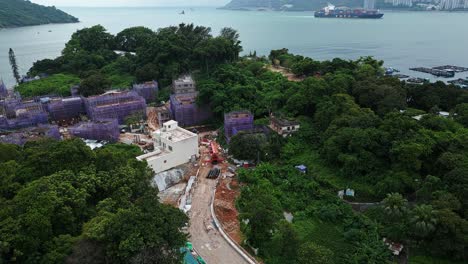 Antena-Sobre-Nueva-Construcción-En-La-Isla-De-Ma-Wan,-Hong-Kong,-China