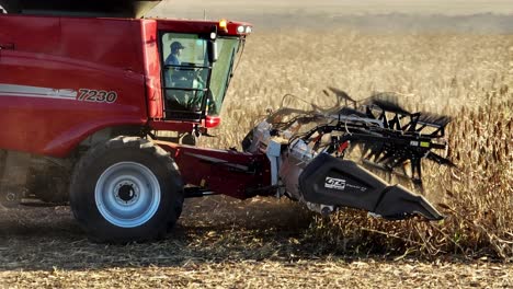 Beautiful-Aeiral-Shot-Harvester-Machinet-Harvesting-Corn-Field-in-Sunset
