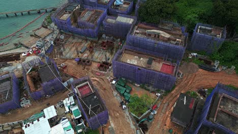 Aerial-over-new-construction-on-the-island-of-Ma-Wan,-Hong-Kong,-China