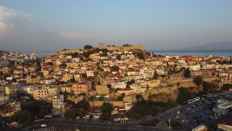 Aerial-ascend-over-fortress-with-traditional-architecture-in-Kavala,-Greece