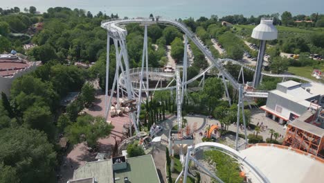 Aerial-Shot-of-Roller-Coaster-at-Gardaland-Amusement-Park-Near-Lake-Garda,-Italy