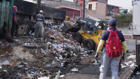 City-workers-use-loader-to-remove-huge-pile-of-urban-trash,-Guatemala