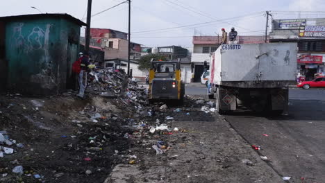 Massive-pile-of-urban-garbage-is-cleaned-up-by-city-workers,-Guatemala