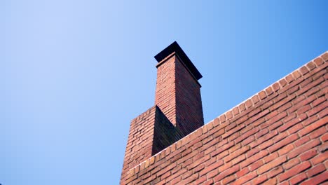 Red-Brick-Chimney-On-The-Roof-Of-A-House-In-Amsterdam,-The-Netherlands