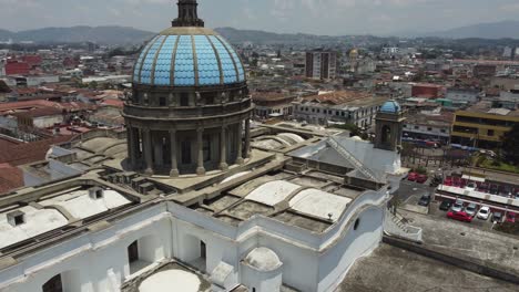 Aerial-flies-past-blue-domes-of-Metropolitan-Cathedral-in-Guatemala