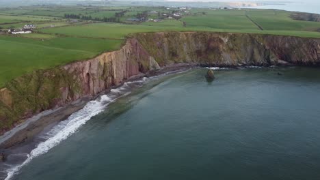 aerial-shot-of-peaceful-afternoon-on-The-Copper-Coast-Waterford-on-a-calm-winter-morning