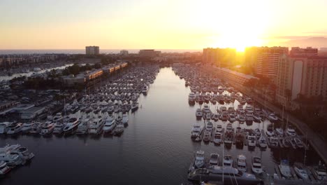 Sunset-over-yachts-docked-at-marina
