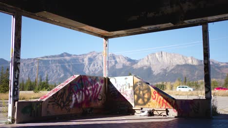 Canadian-Rocky-Mountains-Seen-Though-the-Broken-Windows-of-the-Abandoned-Graffiti-Fort-Chiniki-Building-Off-Trans-Canada-Highway-One-Near-Canmore-Alberta