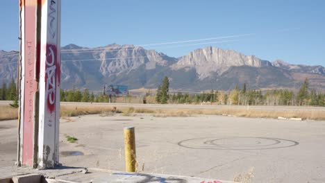 The-Trans-Canada-Highway-One-Near-Canmore-Alberta-Canada-From-Inside-an-Abandoned-Building-with-The-Canadian-Rockies-in-the-Background