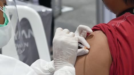 Nurse-Give-Vaccine-Shot-to-Patient,-Close-Up