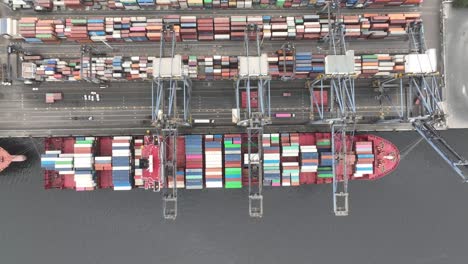 Aerial-Birds-Eye-View-Over-Container-Ship-Docked-At-Karachi-Port-Trust-Terminal