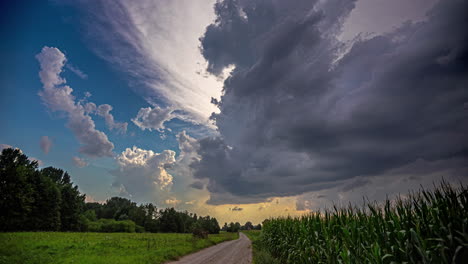 Dramatic-cloudscape-at-sunset-over-a-cornfield---time-lapse