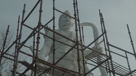 A-giant-statue-with-metal-framework-in-front-of-it