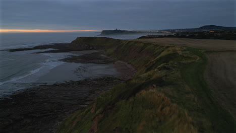 Establishing-Aerial-Drone-Shot-of-Cleveland-Way-at-Blue-Hour-in-Scarborough-on-Misty-Morning