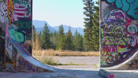 Slow-Zoom-Out-Exploring-the-Abandoned-Graffiti-Art-Building-Fort-Chiniki-Gas-Station-Near-Canmore-Alberta-Canada-off-Highway-One
