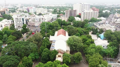 Aerial-of-Rajkot's-Watson-Museum,-aerial-drone-camera-flying-over-the-museum