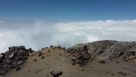 Aerial-flies-over-lone-hiker-atop-Tajumulco-Volcano-in-Guatemala-mtns