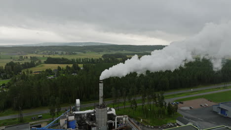 Smokestack-emits-toxic-gases-at-lumber-mill-in-countryside