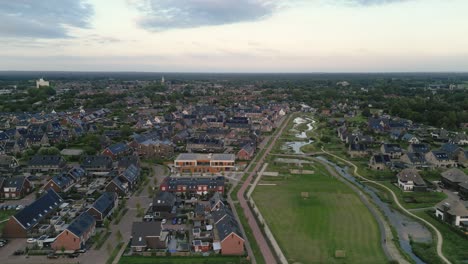 Drone-shot-of-a-residential-area-of-the-city-of-Nijkerk-in-the-Netherlands-with-a-nature-park