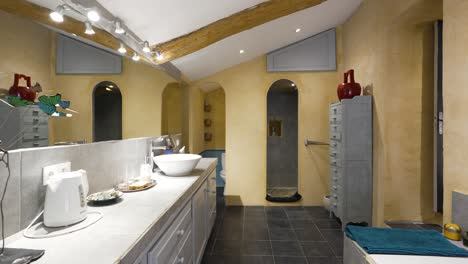 Slow-dolly-shot-showing-a-single-antique-bathroom-within-a-villa-in-Nimes
