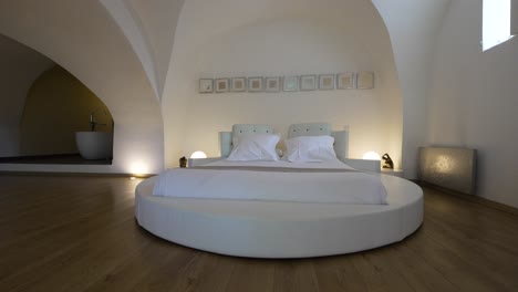 Elegant-Round-Bed-in-a-Spacious-Loft