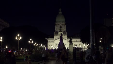 Establishing-shot-of-National-Congress-public-park-at-night-with-people-walking