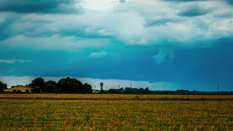 A-Time-Lapse-Shot-Of-A-Wind-Shear-Above-A-Small-Neighbourhood-And-A-Field-Landscape