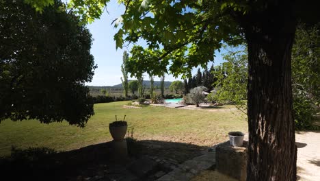 Slow-dolly-shot-revealing-a-beautiful-back-garden-with-a-swimming-pool-at-a-villa-in-Nimes