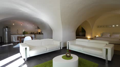 Slow-orbiting-shot-of-a-modern-white-underground-room-within-a-villa-in-Nimes