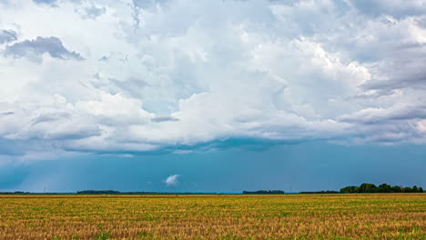 A-Time-Lapse-Shot-Of-A-Turbulence-Above-A-Green-And-Gold-Field-Landscape