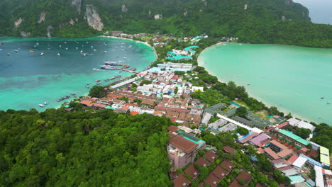 Drone-orbit-tilt-up-establish-koh-phi-phi-harbor-and-isthmus-built-up-with-buildings-and-hotels