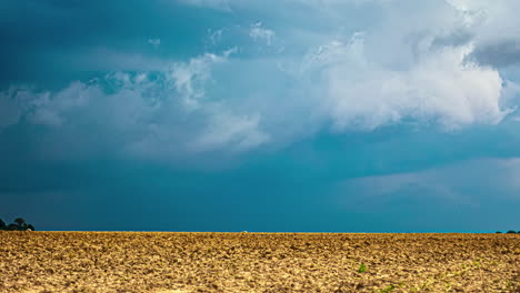 A-Time-Lapse-Shot-Of-A-Blue-Sky-And-A-Wind-Shear-Above-A-Golden-Dry-Field