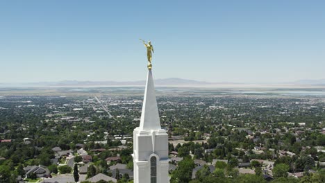 Moroni-Statue-on-LDS-Mormon-Temple-Steeple-in-Bountiful,-Utah---Aerial-Orbit