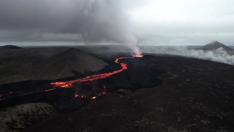 counter-clockwise-high-angle-drone-shot-of-the-litli-hrutur-volcano-in-iceland-with-fog-and-smoke