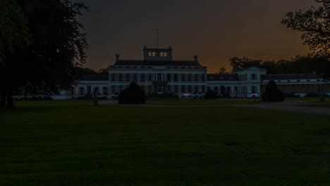 Time-lapse-of-the-sun-rising-behind-a-beautiful-white-palace-in-the-Netherlands---slow-zoom-out