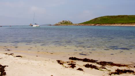Extra-wide-shot-of-the-rock-formation-on-the-island-of-Gugh-and-taken-from-the-sandbar-on-St-Agnes-at-the-Isles-of-Scilly
