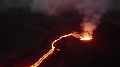 pull-back-high-angle-drone-shot-of-the-litli-hrutur-volcano-in-iceland-with-fog-and-smoke