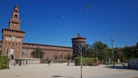 People-outside-the-medieval-fortification-Castello-sforzesco,-Milan