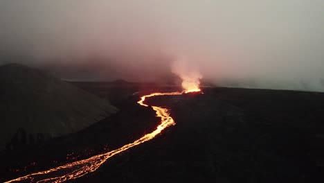 drone-shot-of-the-litli-hrutur-volcano-in-iceland-with-fog-and-smoke-13