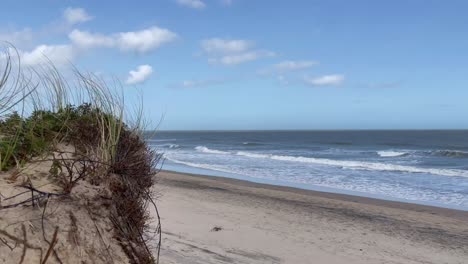 Sand-dunes-with-beach-and-blue-sky