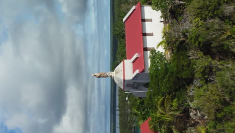 Aerial-view-rising-over-the-Chapelle-Notre-Dame-de-Lourdes,-in-Lifou,-New-Caledonia