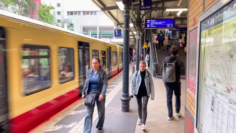 S-Bahn-in-Berlin-Prenzlauer-Berg-entering-Train-Station-with-People