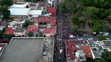 Cultural-elevation,-Guelaguetza-parade-delegations-from-above-in-Oaxaca-City,-Mexico